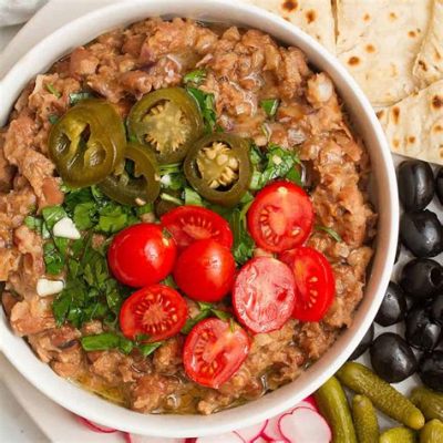  Ful Medames: Een romige bonenschotel vol smaakvolle kruiden en pittige pepers!